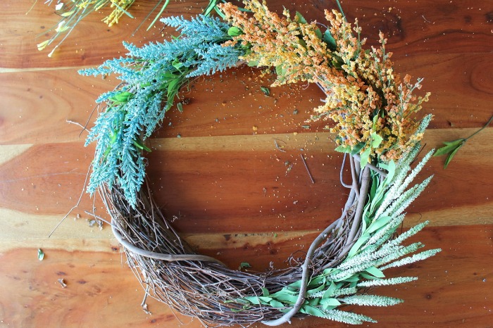 Learn to make this DIY Faux Wildflower Wreath without using glue or floral wire! It's SO easy to make!