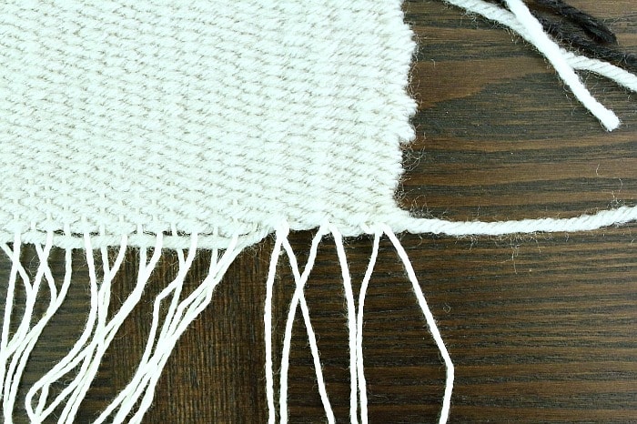 DIY Woven No-Sew Pillow - tie warp strands.