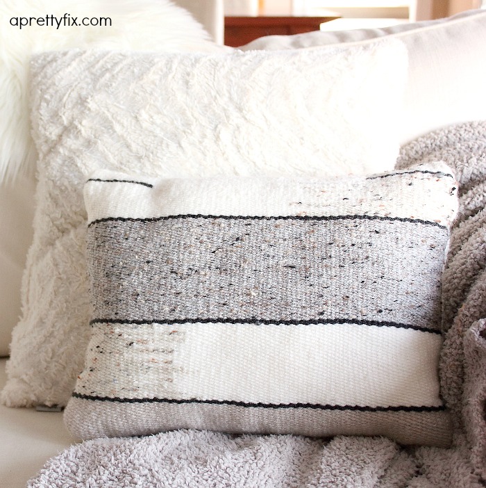 No sewing machine? No problem. Create this DIY Woven No-Sew Pillow with a basic loom, yarn, and pillow stuffing. A simple way to add a homemade touch to your home.