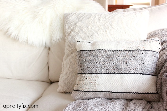 No sewing machine? No problem. Create this DIY Woven No-Sew Pillow with a basic loom, yarn, and pillow stuffing. A simple way to add a homemade touch to your home.