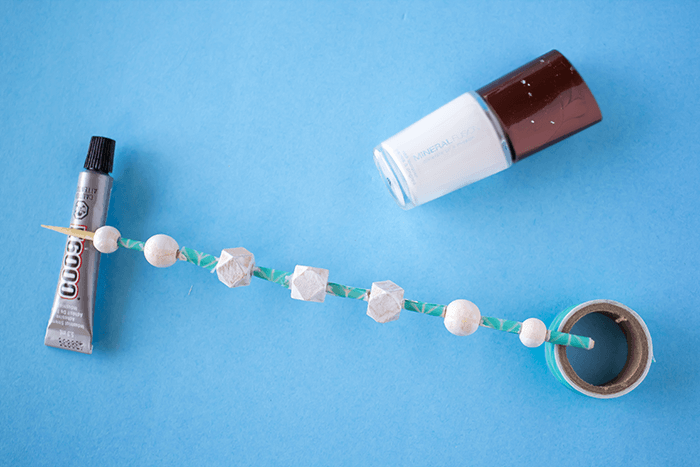 Let white nail polish dry // DIY a Bead Necklace Using Nail Polish