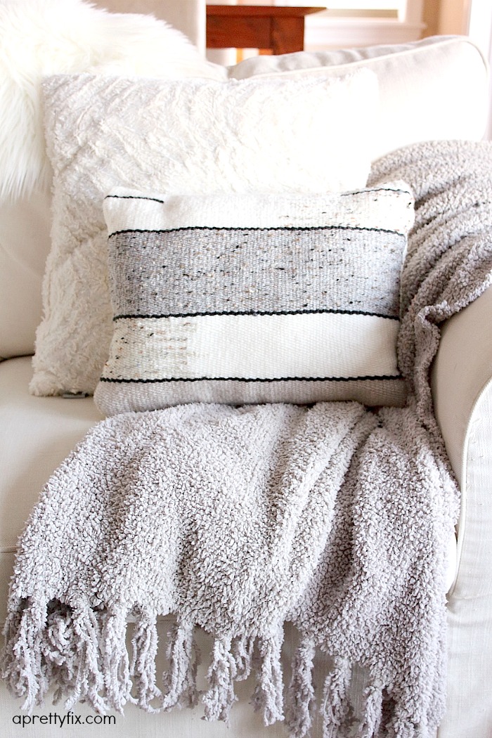 No sewing machine? No problem. Create this DIY Woven No-Sew Pillow with a basic loom, yarn, and pillow stuffing. A simple way to add a homemade touch to your home.