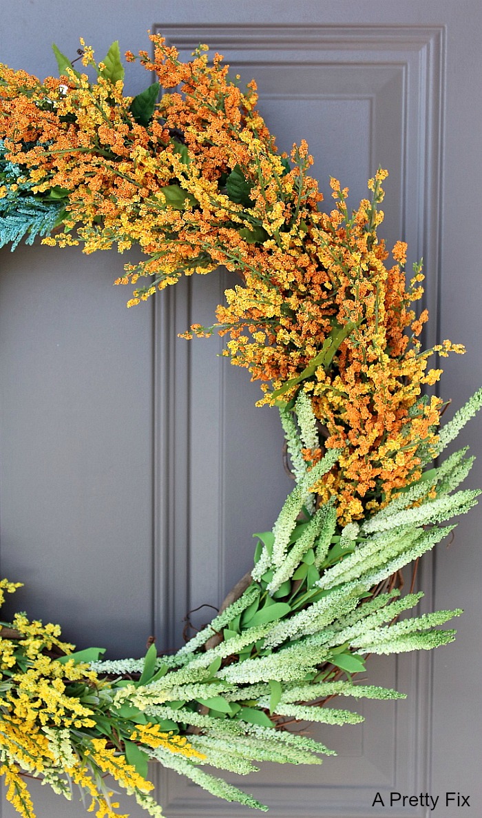 Learn to make this DIY Faux Wildflower Wreath without using glue or floral wire! It's SO easy to make!