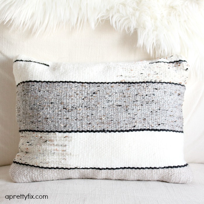 No sewing machine? No problem. Create this DIY Woven No-Sew Pillow with a basic loom, yarn, and pillow stuffing. A simple way to add a homemade touch to your home.