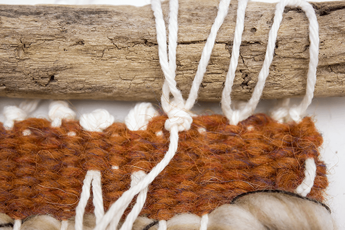 Finishing knot - attaching driftwood to a wall weaving.